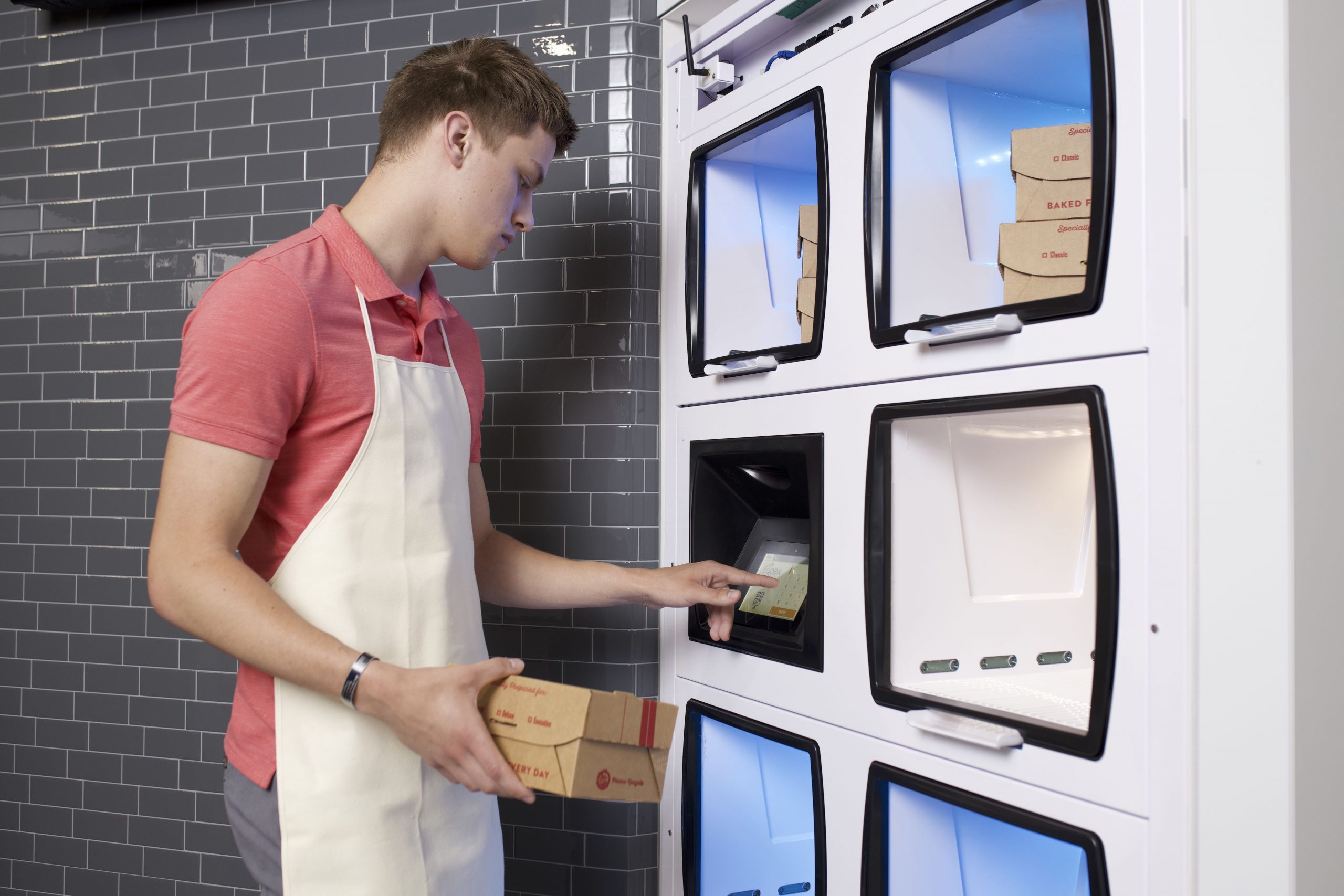 FlowThruEmployee Restaurant employee loads order into Flow-Thru